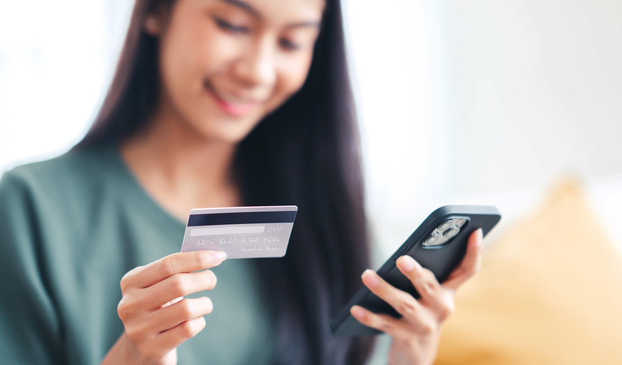 Girl holding credit card